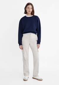 Stradivarius ADJUSTABLE WAIST - Hlačami s stranskimi žepi - beige