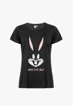 Black cotton T-shirt featuring a cartoon rabbit face with long ears and the text "WHAT'S UP, DOC?" in light pink. Short sleeves, relaxed fit.