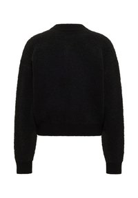 Pull noir texturé avec encolure ronde, manches longues et poignets et ourlet côtelés. Le tissu a une finition douce et duveteuse.