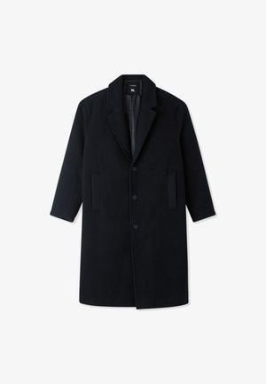 Cappotto lungo nero con colletto a risvolto, tre bottoni e due tasche frontali, taglia XL, posato su uno sfondo bianco.