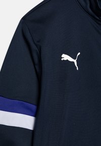 Puma INDIVIDUALRISE TRACKSUIT UNISEX SET - Pantalones deportivos - club navy/lapis lazuli