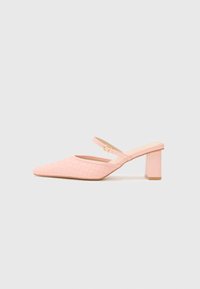 Pink, pointed-toe heeled mules with a woven texture and a thin ankle strap. Features a block heel and a smooth insole.