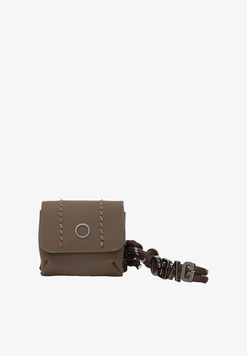 Brown silicone bag with a flap, featuring brown stitching and a circular embellishment. Attached is a braided strap with "OBAG" lettering.