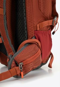 Orange and gray backpack featuring a hexagonal pattern, zippered pockets, adjustable straps, and a textured back panel for ventilation.