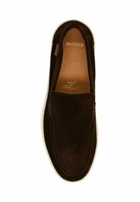 Brown suede slip-on shoe with a white sole, featuring minimal stitching and embossed branding inside. Smooth texture, rounded shape.