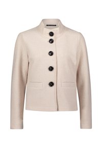 Jasno beżowa kurtka z wysokim kołnierzem, pięcioma czarnymi guzikami z przodu i dwoma przednimi kieszeniami. Teksturowany materiał o gładkim wykończeniu.