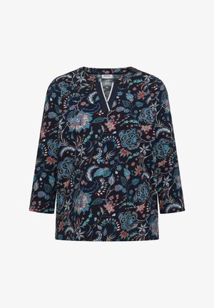 Laivastonsininen pusero, jossa on 3/4-hihat, sinisen, pinkin ja vihreän värinen kukkakuosi sekä V-muotoinen pääntie valkoisella reunuksella.