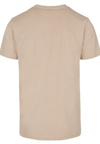 Short-sleeve t-shirt in light beige cotton with a round neck, smooth texture, and no visible logos or patterns on the back.