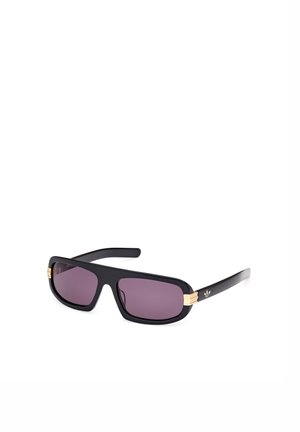 Black plastic sunglasses with dark purple lenses. Features gold accents on the temples and a rectangular, bold, oversized design.