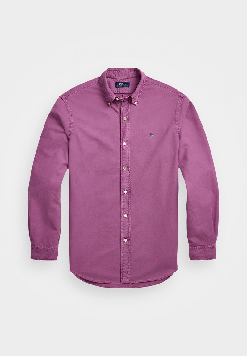 Hosszú ujjú, gombos ing világos lila pamut anyagból, hegyes gallérral, finom logóhímzéssel és gombos mandzsettával.