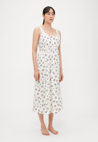 Gėlių midi ilgio suknelė su balta fono spalva, reguliuojamomis plonomis petnešėlėmis, susmulkintu liemeniu ir išmėtytais daugių spalvų gėlių raštais.