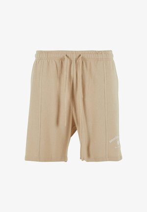 Beiga shorts med våffelstruktur och elastisk midja med dragsko. Har en liten vit tryckt logo på den nedre framsidan.
