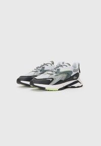 Sport shoes with a mesh upper in gray, white, and black, featuring neon accents, textured overlays, and a padded collar for comfort.
