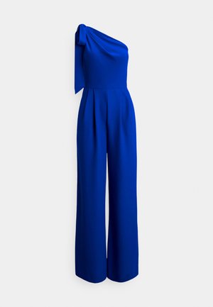 One-shoulder jumpsuit in bright blue, featuring a tied shoulder detail, structured bodice, wide-leg pants, and a smooth, textured fabric.