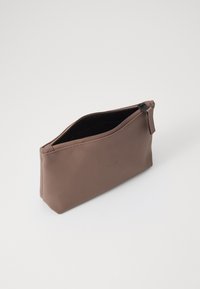 Brown zippered pouch made of smooth material with a matte finish. Features a subtle embossed logo and a contrasting interior lining.