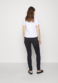 Calvin Klein Jeans MID RISE SKINNY - Aptempti džinsai - washed black