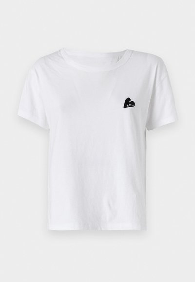 White cotton t-shirt with short sleeves and a round neckline. Features a small black heart logo on the left chest area.