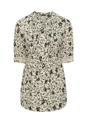 Blusa crema con stampa floreale nera, maniche corte, apertura frontale con bottoni e un dettaglio plissettato vicino al colletto.