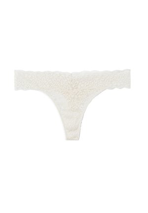 Lace thong in off-white, featuring floral patterns, scalloped edges, and thin sides. Made of soft, textured fabric for comfort.