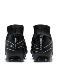 Black soccer cleats with a textured surface, high ankle design, and blue accents. Features prominent Mercurial branding on the heel.