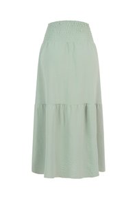 Jupe midi vert clair avec une large ceinture smockée et un ourlet fluide, légèrement évasé. Pas de motifs, boutons ou poches visibles.