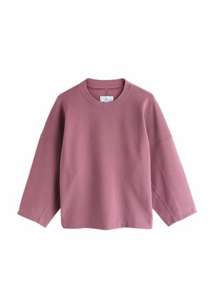 Rosa Sweatshirt mit rundem Ausschnitt, langen überschnittenen Ärmeln und lockerer Passform. Hergestellt aus einem weichen, strukturierten Stoff.