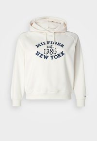Fehér kapucnis pulóver, puha anyagból készült, húzózsinóros kapucnival, bordázott mandzsettákkal és hemekkel, navy kék "HILFIGER est. 1985 NEW YORK" hímzéssel.