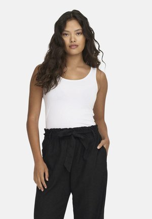 White tank top paired with black, loose-fitting pants featuring a tied waist and side pockets. Smooth fabric with a relaxed design.