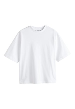 Valkoinen ylisuuri t-paita, jossa lyhyet hihat ja pyöreä pääntie, yksivärinen, esitetty valkoisella taustalla.
