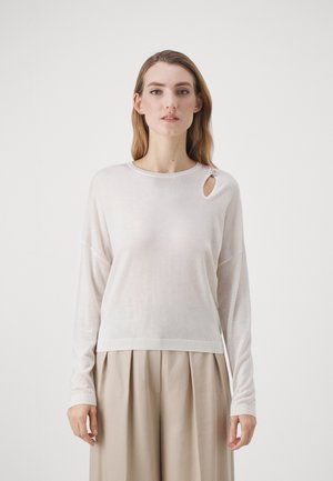 Maglione a maniche lunghe color beige chiaro con un'apertura circolare vicino al collo e bordo a costine. Tessuto morbido, vestibilità rilassata, design minimalista.