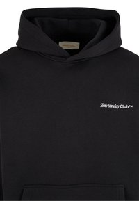 Black hoodie made of cotton with a front kangaroo pocket. Features the text "Slow Sunday Club™" in white on the chest area.