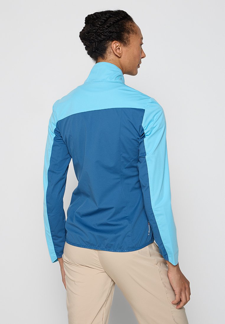 Giacca zip-up blu e azzurro chiaro con colletto alto, maniche lunghe e design aderente. Caratterizzata da un tessuto liscio e leggero con cuciture piatte.