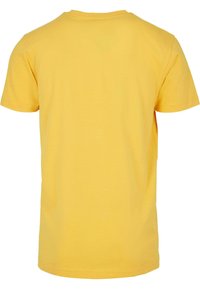 Gul bomull t-skjorte med korte ermer, rund hals og glatt tekstur. Baksiden har et enkelt, udekorerte design.