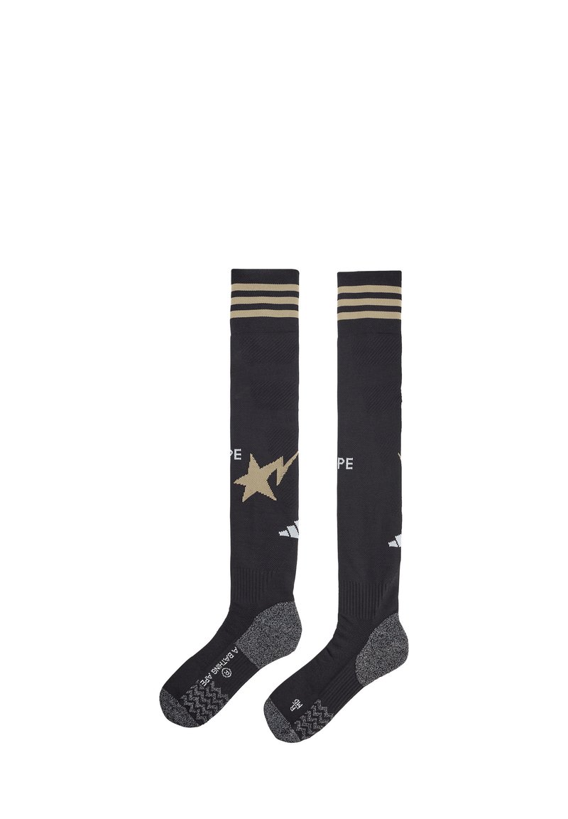 Knielange schwarze Socken mit goldenen Streifen oben, ausgestattet mit einem goldenen Sternmuster und strukturierten grauen Sohlen.