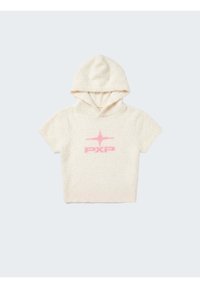 Sweat à capuche court crème, doux au toucher, avec un logo rose "FXP" et un motif étoile sur le devant, sur fond uni.