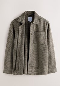 Veste homme à ouverture frontale avec motif pied-de-poule marron et beige, manches longues, col et poche poitrine, présentée sur un fond uni.