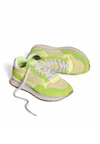 Sneakers featuring a mix of pale yellow and vibrant green suede with lavender accents, a cushioned sole, and purple laces.