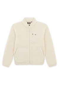 Giacca in fleece di colore crema con zip, colletto alto, due tasche laterali e una tasca sul petto con un logo sul lato sinistro in alto.