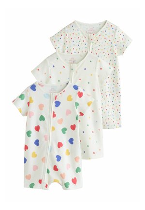 Trois grenouillères blanches à manches courtes pour bébé avec fermeture éclair à l'avant, présentant des motifs de cœur coloré, petite fleur et pois multicolores.