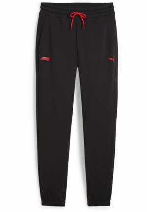 Sorte sweatpants med snøre i taljen, røde detaljer og lommer. Har et rødt logo på venstre lår og elastiske manchetter ved anklerne.