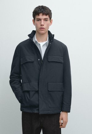 WATER-REPELLENT PUFFER WITH POCKETS - Übergangsjacke - dark blue
