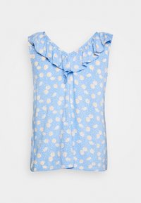 Blå ärmlös topp med volangkrage, prydd med ett prästkragens mönster på en prickig bakgrund. Tillverkad av lätt tyg.