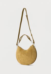 Suede shoulder bag in mustard yellow, crescent shape with a silver zipper, adjustable strap, and dual handles for versatile carrying.