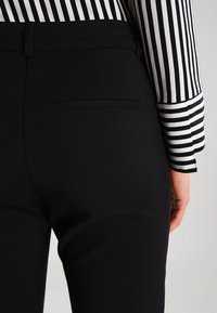 Vero Moda - Bukser black/sort Zalando.dk