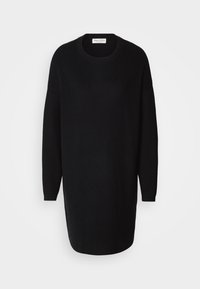 Robe-pull en maille noire à manches longues, col rond, poignets côtelés et une étiquette à l’intérieur du col.