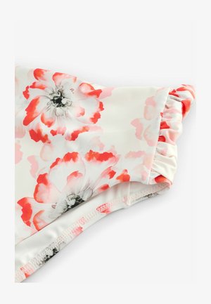 Floral swimsuit in soft white fabric featuring pink and red flower patterns, gathered edges, and smooth texture. Notable ruffled detail.