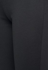 Pieces PCOTINE FLARED PANTS - Calças - black