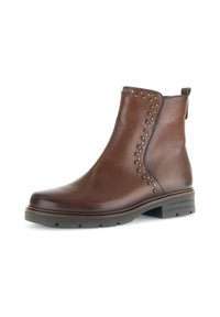Braune Leder-Stiefelette mit Nietenakzenten, abgerundeter Zehenpartie, Zugschlaufe und strukturiertem Sohlenprofil. Verfügt über ein glattes Finish und einen niedrigen Absatz.