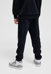 Hummel LODIN - Trainingsbroek - black asphalt