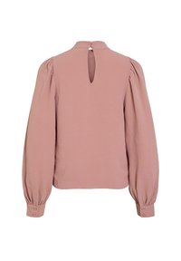 Rosa blus med långa puffärmar, texturerad tyg, nyckelhål i ryggen med knapp och elastiska manschetter. Rak skärning.